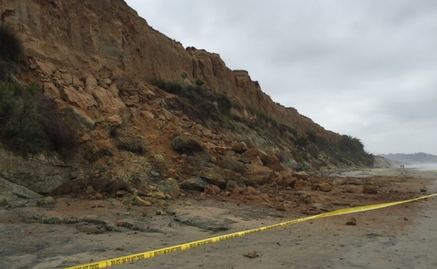 A bluff collapses along a beach in Del Mar, July 13, 2016
