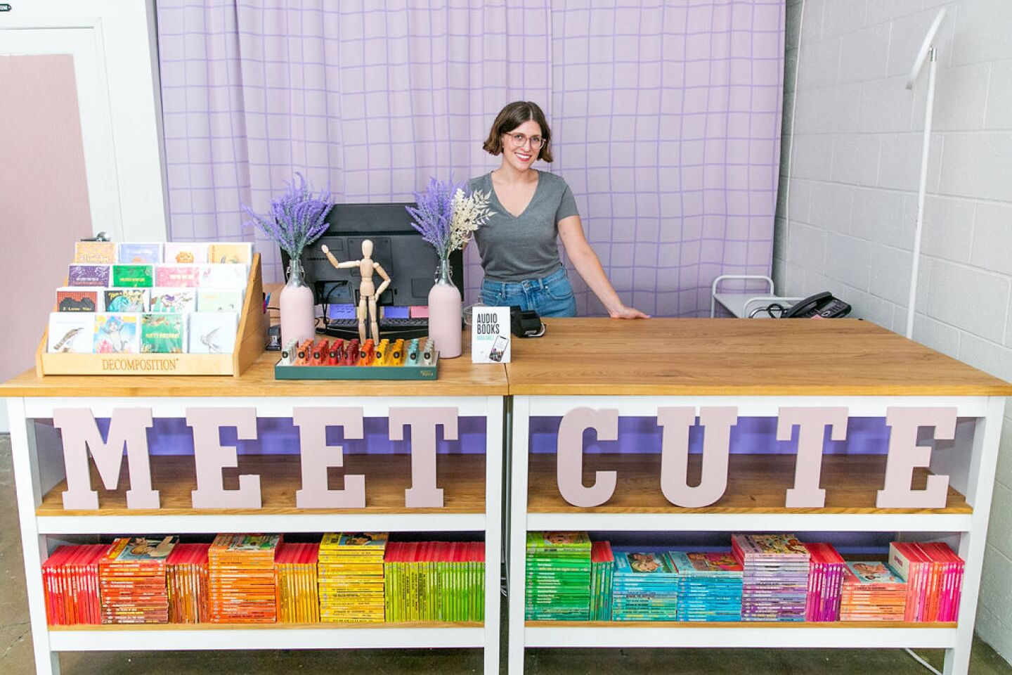 Meet Cute owner Becca Still sits at the cash register in this undated photo.