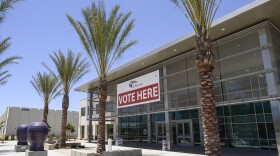 A "vote here" sign welcomes voters at the San Diego County Registrar of Voters Office in Kearny Mesa on May 31, 2014.