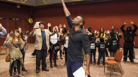 At a San Diego City Council inauguration ceremony, Mark Jones leads a group protesting police brutality, Dec. 10, 2014. 