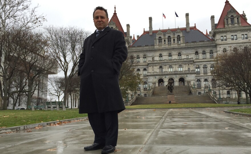 Bruce Roter standing in front of the New York State Capitol, a place he says some would claim is "the epicenter of all that's wrong with New York state government."