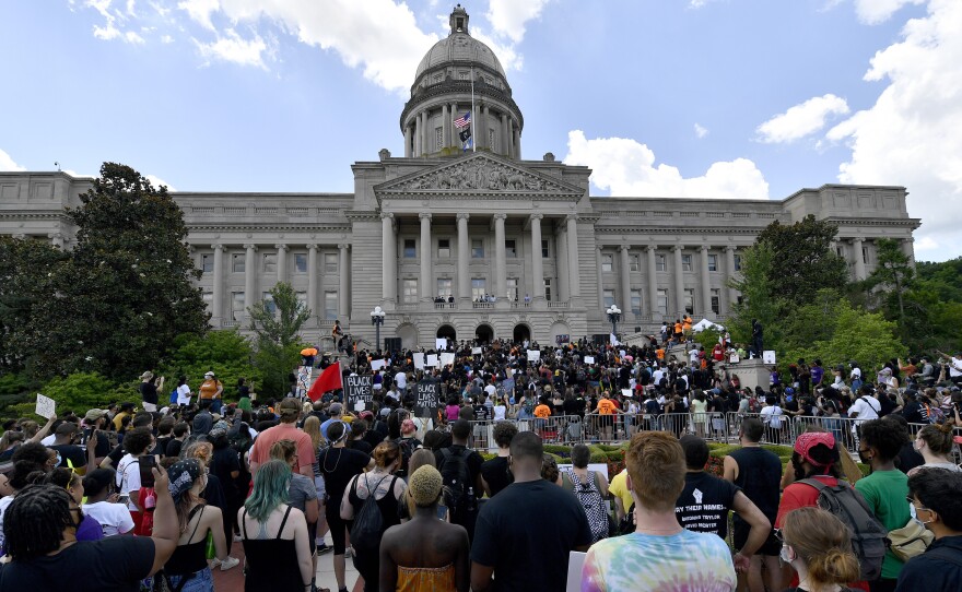 A crowd gathers for a rally to demand justice in the death of Breonna Taylor on the steps of the the Kentucky State Capitol in June. Taylor was killed in her apartment while Louisville police served a warrant.
