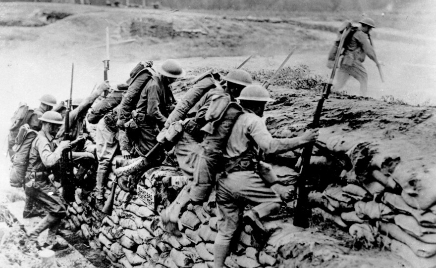 American troops climb over a sandbag barrier in France during World War I in 1918. The U.S. waited almost three years before entering the war, but the fresh American troops played a major role in deciding the outcome of a conflict that has been locked in stalemate. April 6 marks the 100th anniversary of the U.S. entrance into the war.