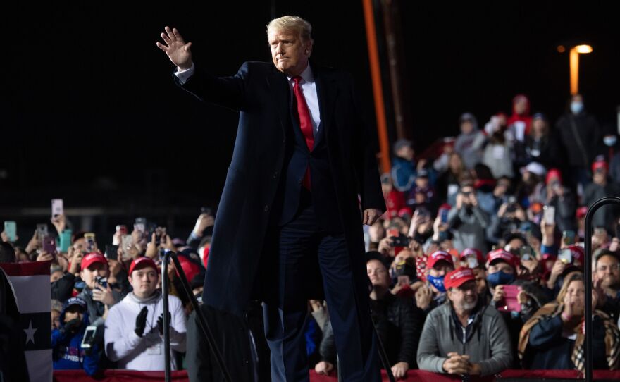 President Trump waves at the end of a rally at Erie International Airport in Erie, Pa., on Tuesday evening.