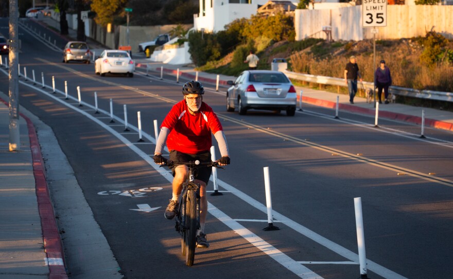 Francois Beareaud, a South Park resident, rides his bike down 30th St. in San Diego, Dec. 20, 2022.