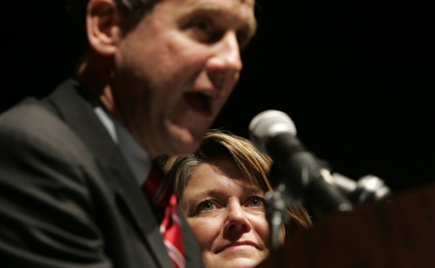 Connie Schultz, a Pulitzer Prize-winning journalist, watches as her husband, Ohio Democrat Sherrod Brown, gives his victory speech after being elected senator in 2006.