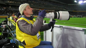 Bostonian sports photographer Andrew Katsampes shoots game play.