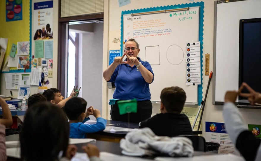 Dawn Payne, a science and music teacher at Buttonwillow Union Elementary, teaches the kindergarten class a lesson about shapes on March 27, 2023.