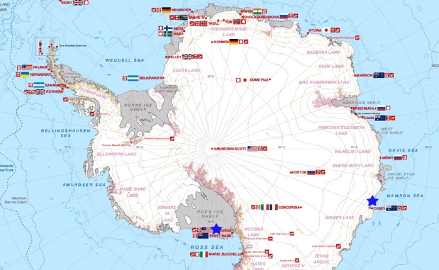 A map of Antarctica showing international research stations. The U.S. and Australia bases are marked with blue stars.