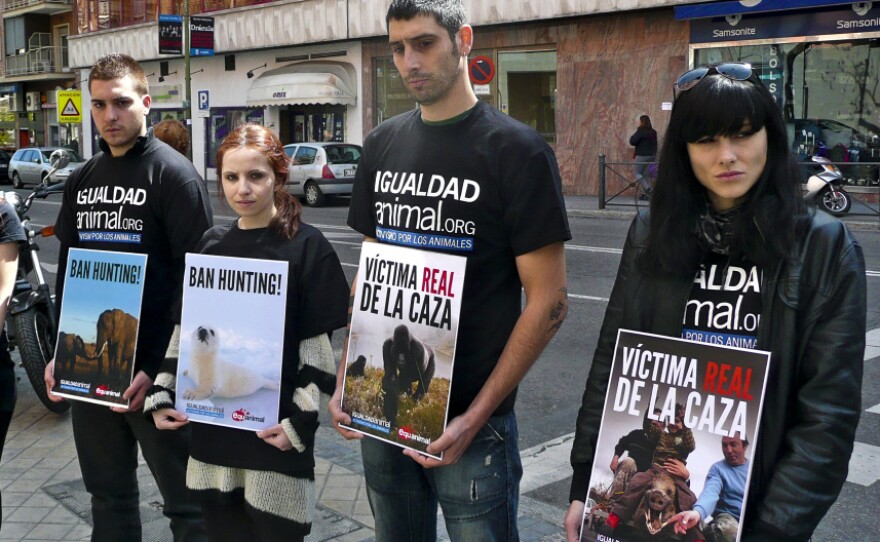 Members of the animal-rights group Igualdad Animal protest outside the Madrid hospital where Spanish King Juan Carlos was recovering after hip surgery this week. The king, who went elephant hunting in Africa, is the honorary president of the World Wildlife Fund in Spain.