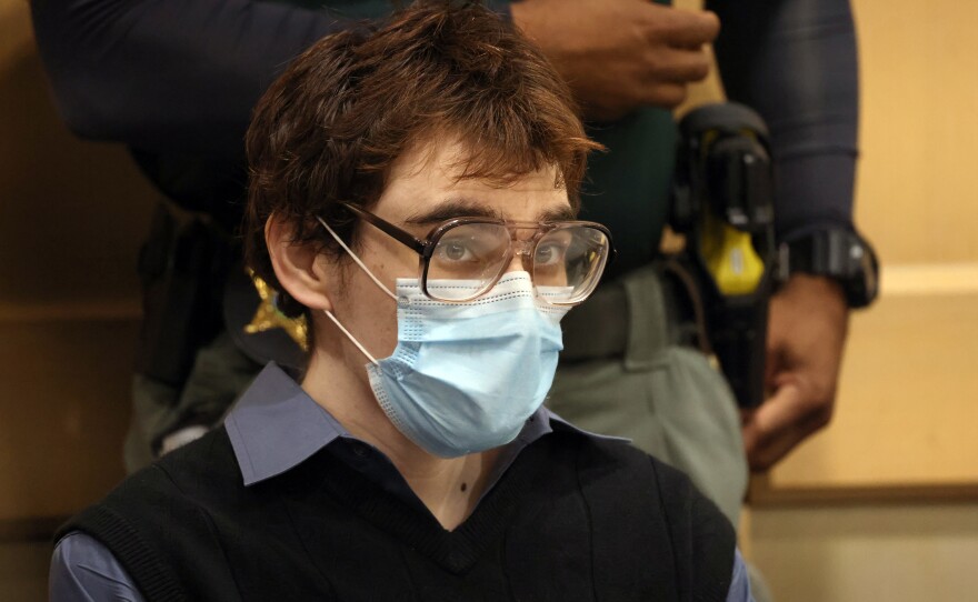Nikolas Cruz is shown seated at the defense table in court to plead guilty to all 17 counts of premeditated murder and 17 counts of attempted murder at the Broward County Courthouse on Oct. 20, 2021.