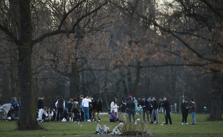 Young people gather in the Volkspark am Friedrichshain in Berlin on March 18. Germany's fatality rate so far — just 0.5% — is the world's lowest, by a long shot.