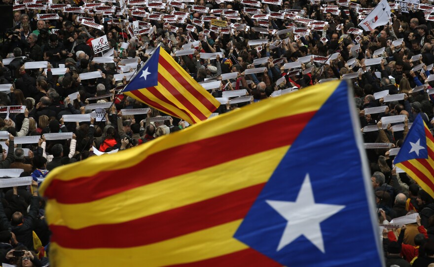 Thousands of people rally outside the regional presidential palace in Barcelona, protesting the arrest of Catalan politicians and pushing for Catalonia's independence, which was formally annulled in court Wednesday. The crowd is awash in Catalan independence flags and signs reading "free political prisoners."
