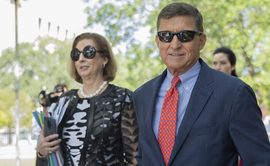 Michael Flynn, President Donald Trump's former national security adviser, leaves federal court with lawyer Sidney Powell, left on  Tuesday, Sept. 10, 2019.