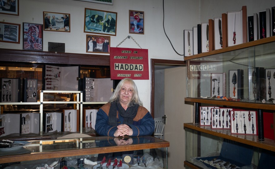 Grace Rizk, 65, works at a shop selling locally made cutlery in downtown Jezzine. After living here for 15 years she says the war will never make her leave.