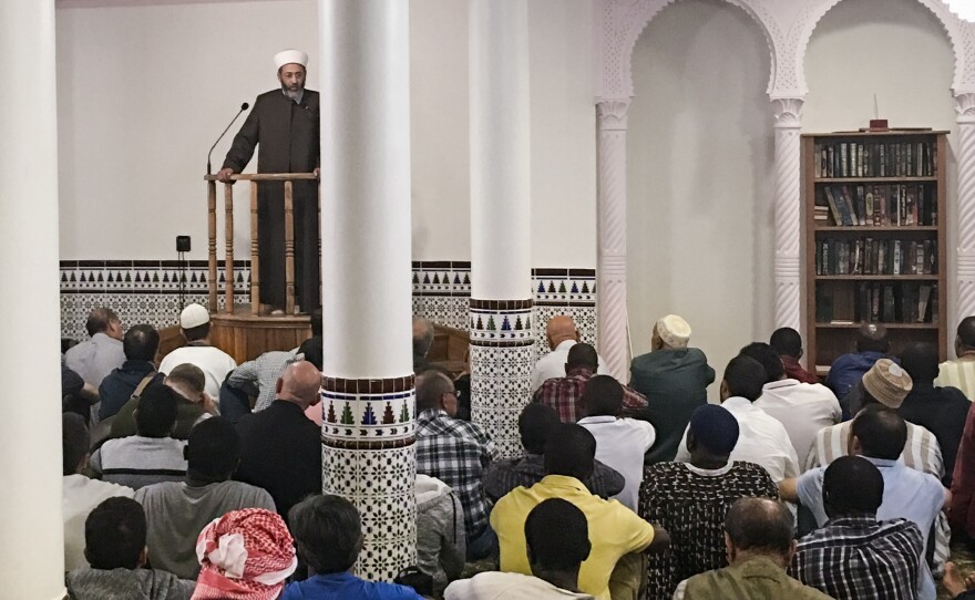 Tareq Oubrou, an imam in Bordeaux, delivers a sermon in French and Arabic at the city's grand mosque. Most imams in France speak only in Arabic.