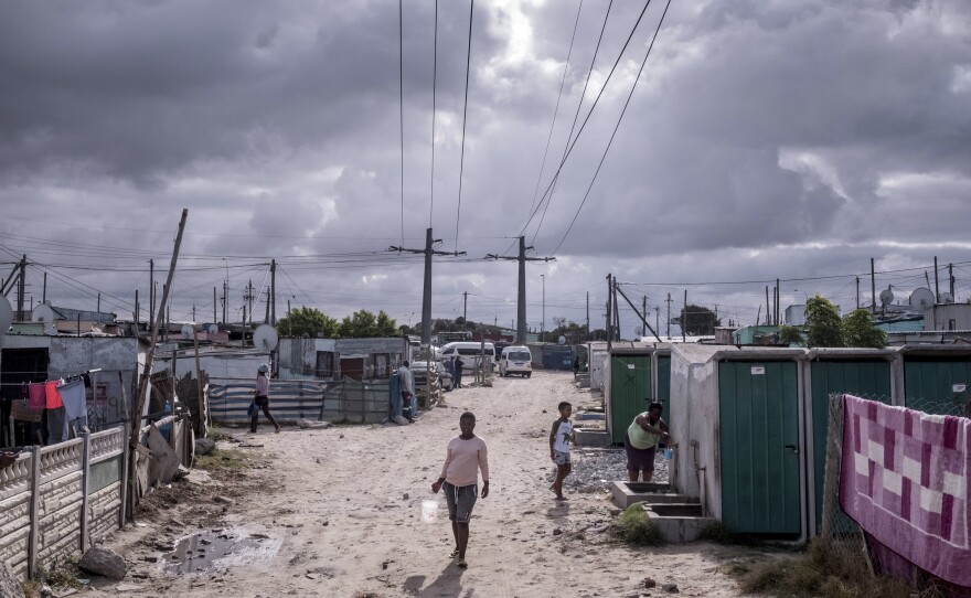 Residents of the township of Khayelitsha visit a communal water tap on day nine of South Africa's coronavirus lockdown.