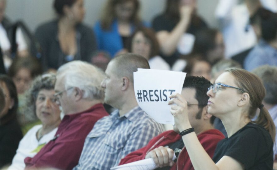A community member displays her view during a community forum in Sacramento where hundreds gathered to voice their opinions and ask questions of Sheriff Scott Jones and Acting ICE Director Thomas Homan, Tuesday, March 28, 2017.