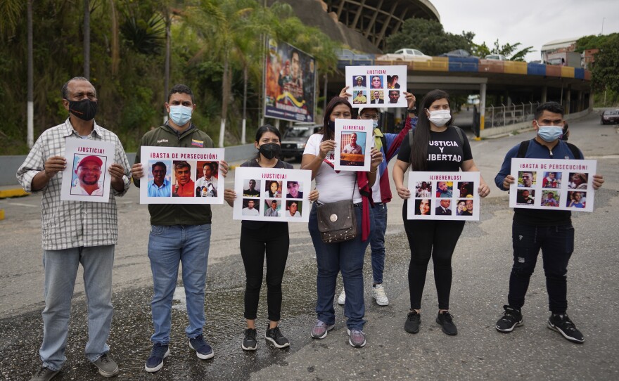 Andreina Baduel (second from right) joins others to protest against the taking of what they call political prisoners outside the Bolivarian National Intelligence Service building known as El Helicoide, in Caracas, Venezuela, Nov 3, 2021. Baduel is the daughter of former Defense Minister Raúl Isaías Baduel, who died in prison in 2021.