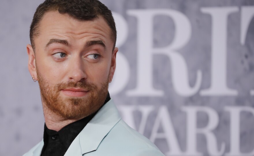 Sam Smith on the red carpet at the BRIT Awards in February 2019 — the British singer-songwriter came out as nonbinary later that year.