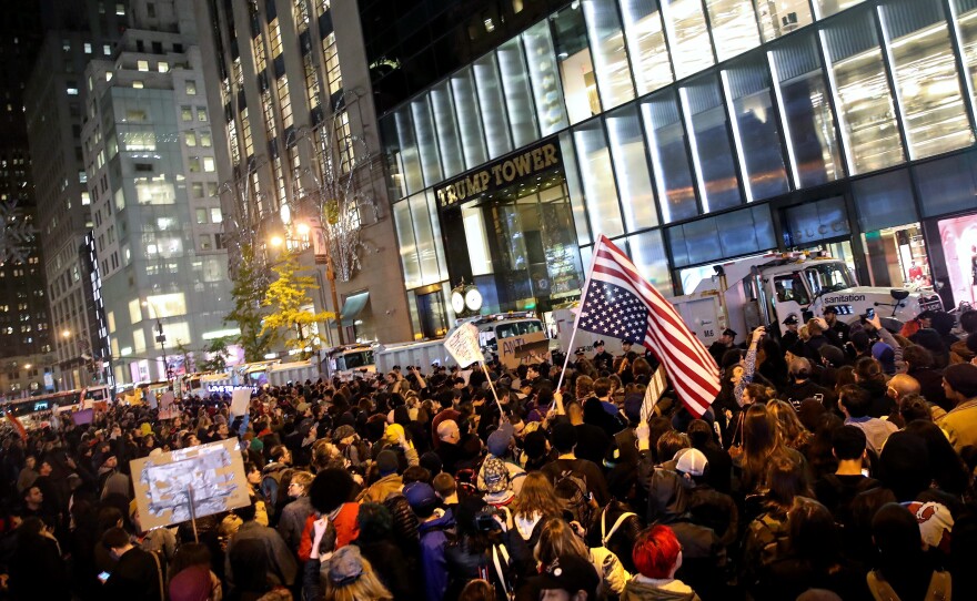 Hundreds of protestors rallying against Donald Trump gather outside of Trump Tower in New York on Wednesday evening.