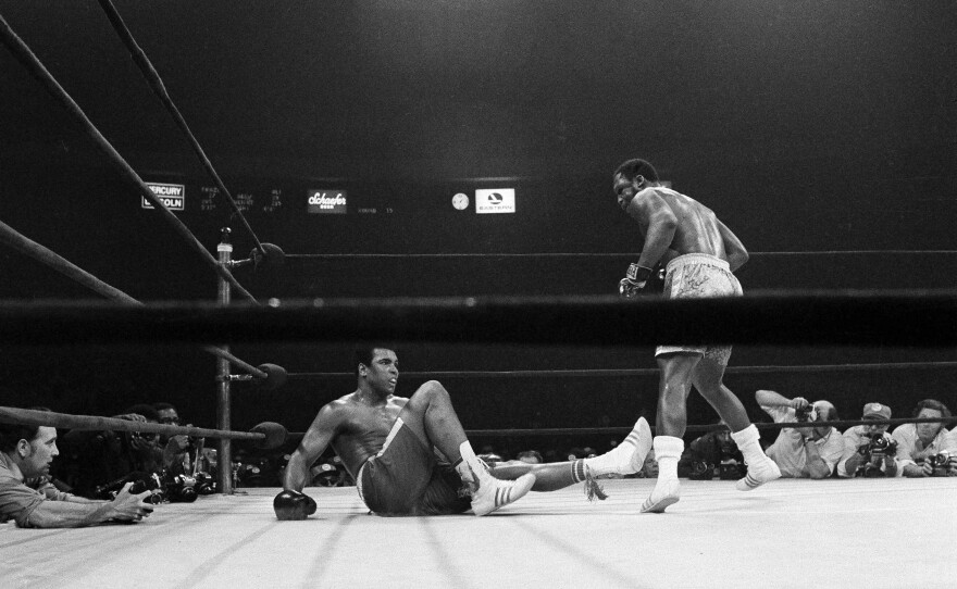 Ali lies on his back with Joe Frazier, the heavyweight champion, standing over him after a 15th-round punch by Frazier dropped him in New York, March 8, 1971. Frazier retained his title with a unanimous decision over Ali.