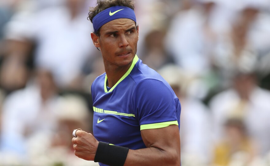 Rafael Nadal celebrates a point against Stan Wawrinka during the final of the French Open. Nadal, who has dominated on clay in his career, did not leave the outcome in doubt for long. The Spaniard claimed his record 10th French Open title on Sunday.