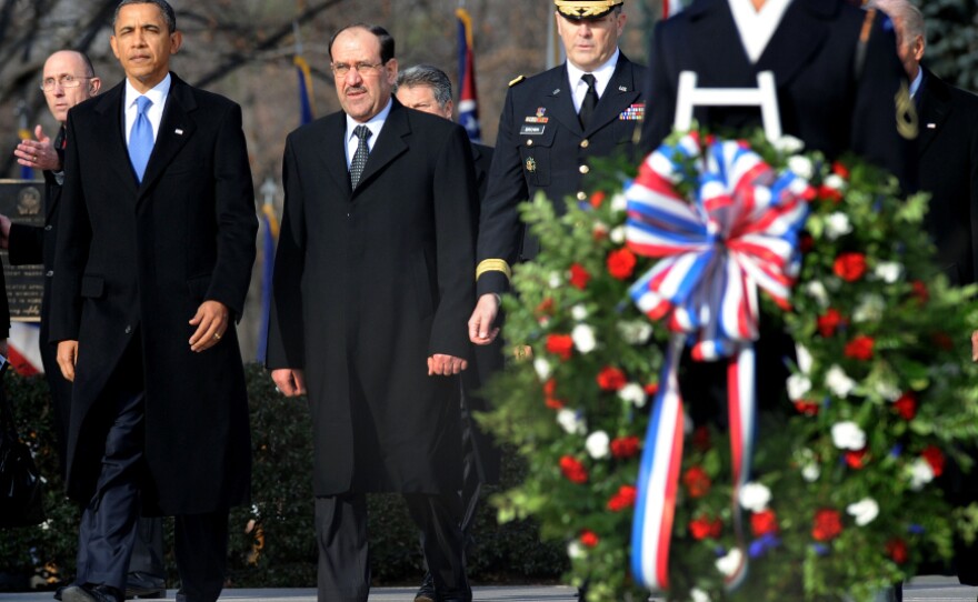President Obama and Iraqi Prime Minister Nouri al-Maliki (second from left) participate in a wreath-laying ceremony at Arlington National Cemetery on Monday. Maliki was in Washington for talks ahead of the full withdrawal of U.S. troops from Iraq this month.