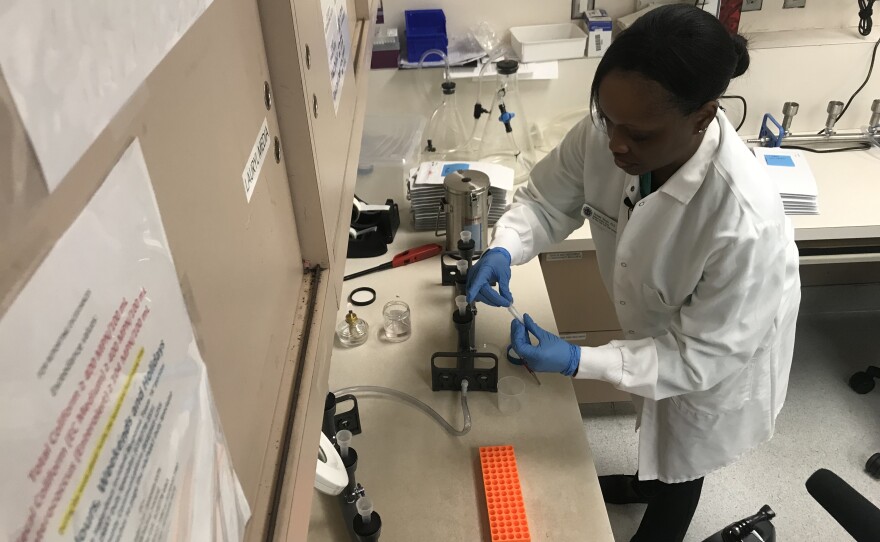 Streeya Steele is testing a water sample in the San Diego County Public Health Lab on Aug 12, 2019.