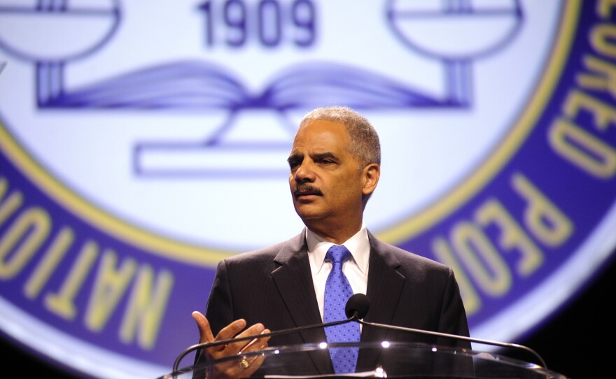 Attorney General Eric Holder speaks at the annual convention of the NAACP in Orlando, Fla., on Tuesday. Holder told the convention that "Stand Your Ground" laws that have been adopted in 30 states should be reconsidered.