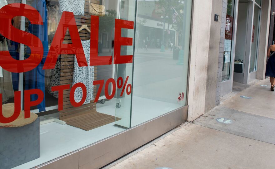 A store advertises discounts in Santa Monica, Calif., on July 28 amid the coronavirus pandemic. Economic growth data on Thursday are expected to show a record-setting figure for the third quarter, but that covers the more worrisome picture underneath the surface.