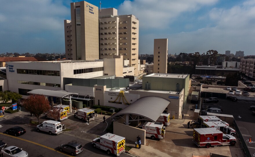 Ten ambulances wait outside the Scripps Mercy Hospital emergency room in the Hillcrest neighborhood of San Diego on January 7, 2022.