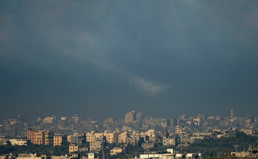 Leaflets are dropped by the Israeli army over Gaza City on Nov. 16, telling people to share any information they have about Israeli hostages being held in their area.
