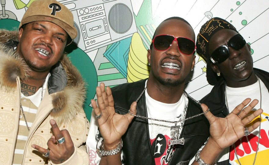 3 members of the Memphis hip-hop group Three 6 Mafia. D.J. Paul (from left), Juicy J and Crunchy Black at MTV's Total Request Live on March 22, 2006, in New York City.