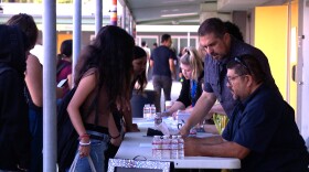 Bell Middle School students pick up their class schedules on the first day of school on Monday, Aug. 11, 2025.