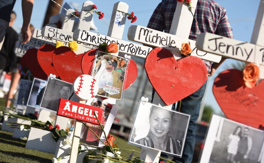 Some of the 58 white crosses for the victims of Sunday night's mass shooting last Sunday, on the Las Vegas Strip south of the Mandalay Bay hotel on Friday. "Their names and their stories will forever be etched into the hearts of the American people," Vice President Pence said while visiting the city on Saturday.