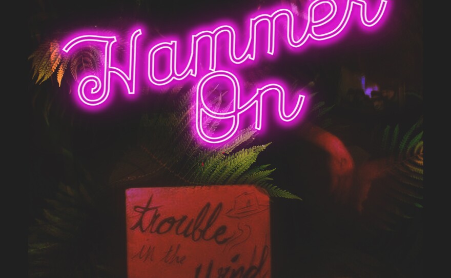 The cover of Trouble in the Wind's latest album, "Hammer On."