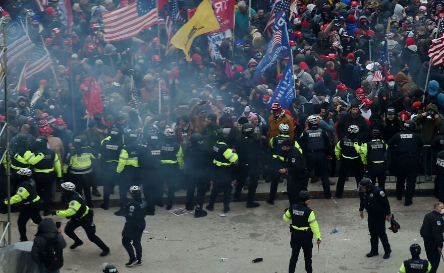 Police hold back supporters of Donald Trump as they gather outside the U.S. Capitol on January 6, 2021, in Washington, DC.