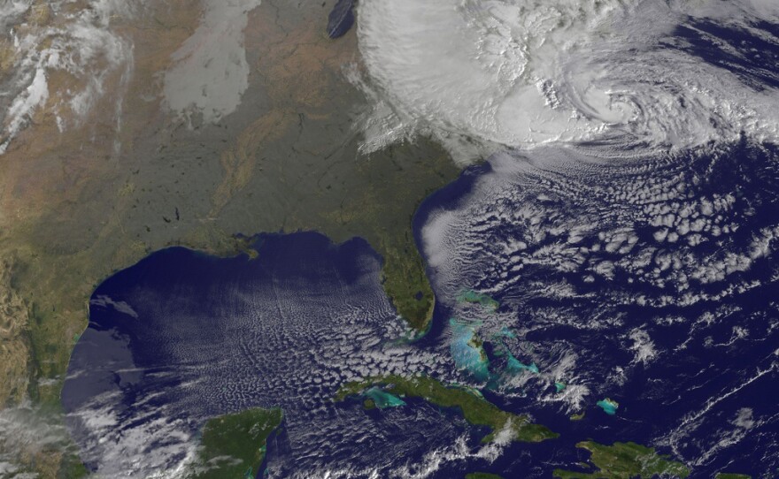 NOAA's GOES-13 satellite captured this visible image of Hurricane Sandy battering the U.S. East coast on Mon., Oct. 29, 2012 at 9:10 a.m. EDT. At 8 a.m. EDT the National Hurricane Center noted that the center of Hurricane Sandy was located near latitude 36.8 north and longitude 71.1 west. This was about 310 miles (505 km) south-southeast of New York City, and 265 miles (425 km) southeast of Atlantic City, N.J. Sandy was moving north-northwest at 20 mph. Maximum sustained winds are now near 85 mph (140 kph). Tropical Storm force winds extend almost 500 miles from the center, making those winds 1,000 miles in diameter.