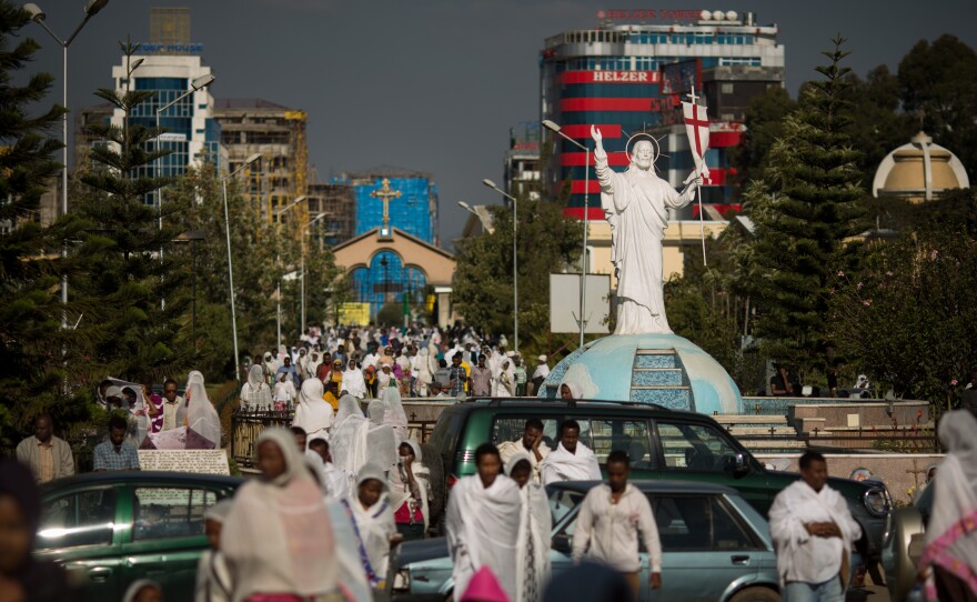 Worshippers stream through downtown Addis Ababa, Ethiopia, toward Bole Medhane Alem (Savior of the World) Cathedral, the largest Orthodox Church in Africa.
