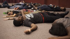 Protesters staged a "die-in" Wednesday during the San Diego City Council inauguration ceremonies. 