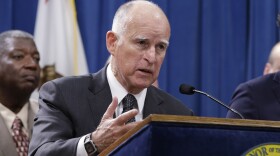 California Gov. Jerry Brown discusses proposed legislation to increase the state's minimum wage to $15 per hour by 2022, during a news conference in Sacramento, March 28, 2016.