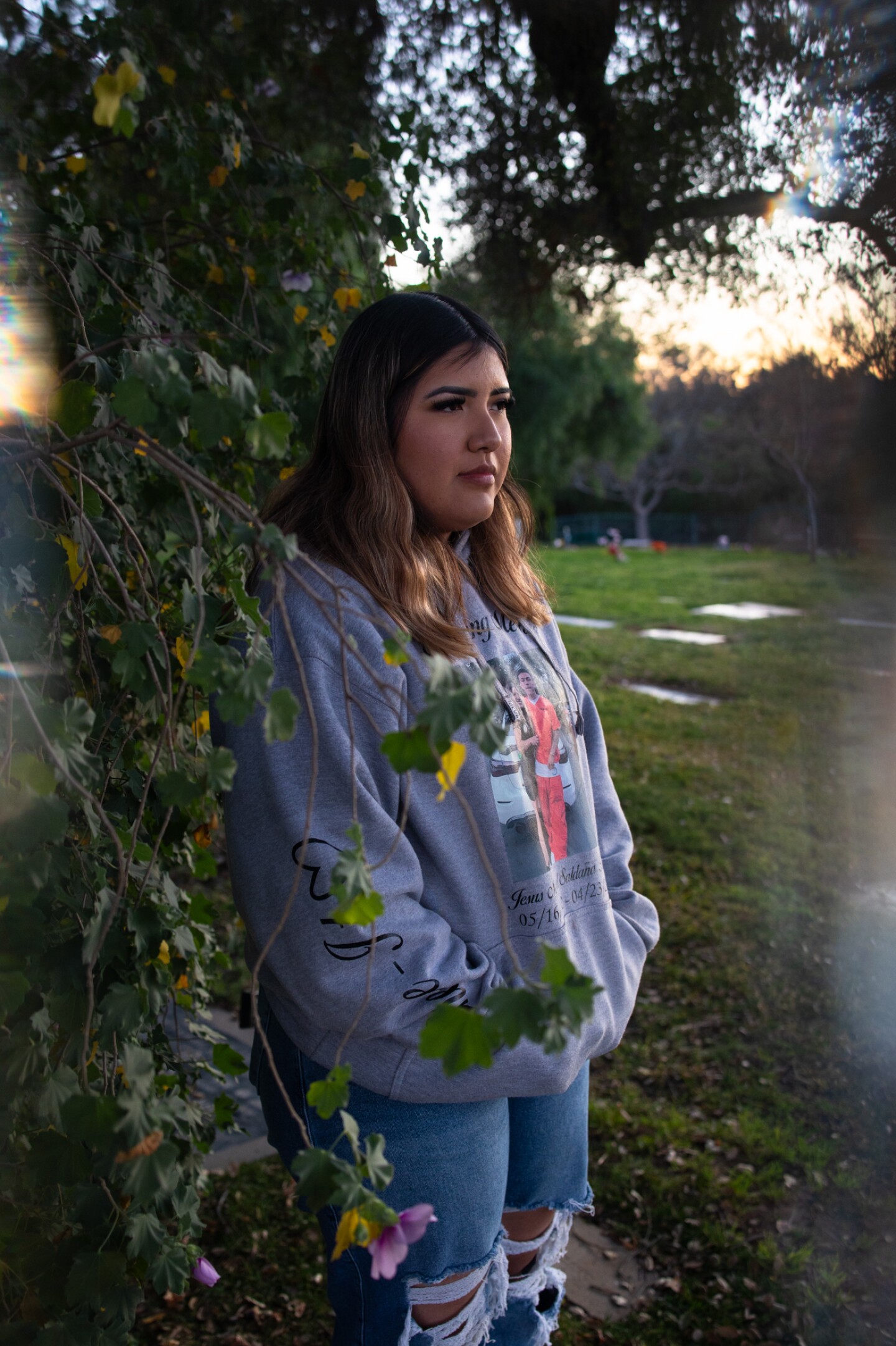 Amairani Rodriguez is photographed near the gravesite of her boyfriend Jesús Manuel Saldaña Rocha, Feb. 8, 2023.