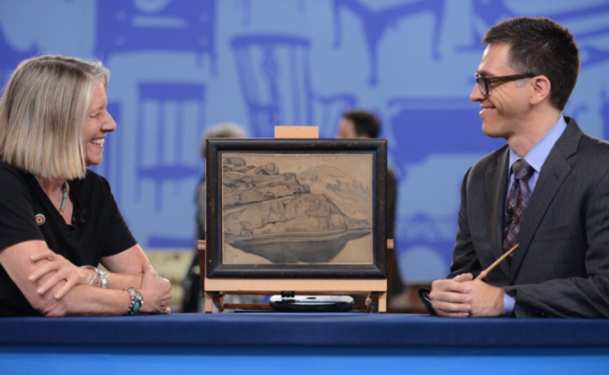 Aaron Bastian (right) appraises a Nicholas Roerich charcoal sketch, ca. 1917 in Albuquerque, New Mexico.