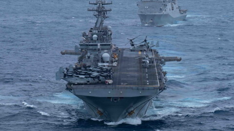 Wasp-class amphibious assault ship USS Boxer (LHD 4), front, and San Antonio-class amphibious transport dock ship USS Portland (LPD-27), sail in formation in the U.S. Central Command area of responsibility, June 30, 2026.