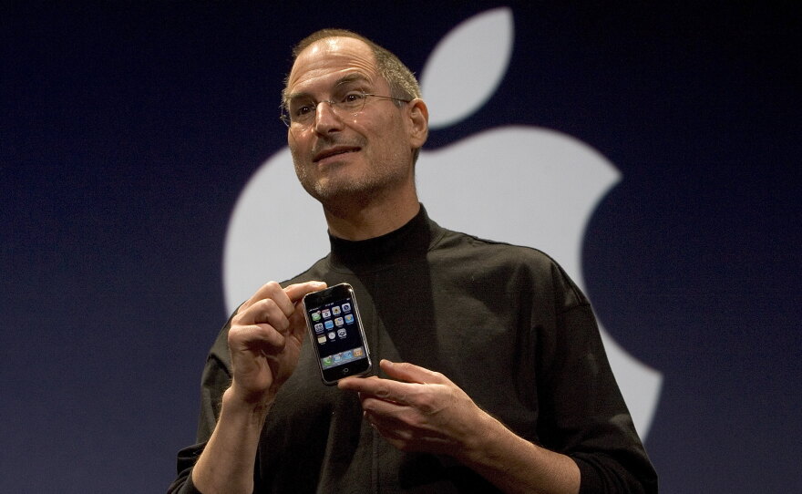 Apple CEO Steve Jobs unveils the iPhone in 2007.  A new working paper suggests the spread of smartphones helps explain the persistent decline in birth rates in the nearly two decades since.