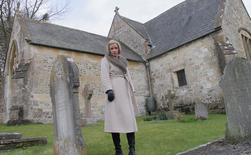 Lucy Worsley in Churchyard where a boy in Rode Hill House murder is buried in A VERY BRITISH MURDER.