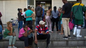 People wait their turn to enter a bank in Havana, Cuba, Wednesday, April 1, 2026.