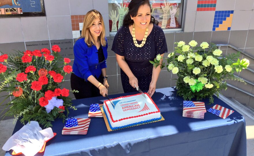 Interim San Diego County District Attorney Summer Stephan (left) and California Assemblywoman Lorena Gonzalez Fletcher (D-San Diego), pose while cutting a cake at the second annual City Heights Law Day event in April 2017.
