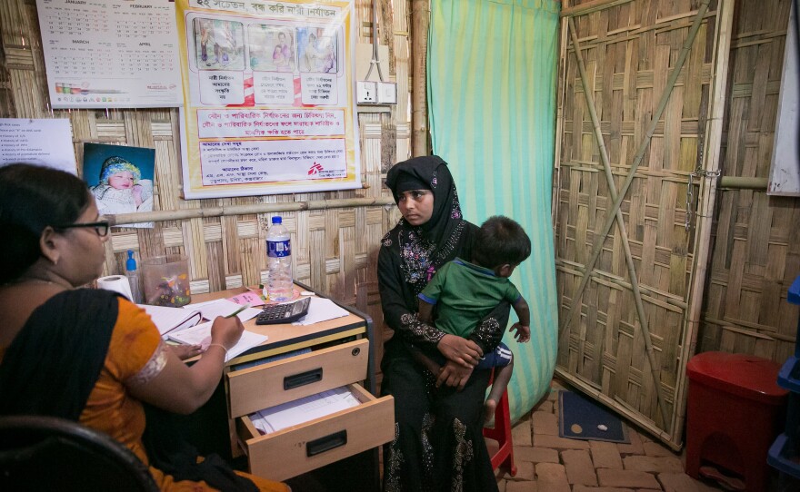 Sanura Begum at a Doctors Without Borders clinic with her son, Abdur Sobor, near the Kutupalong refugee camp. Before coming to Bangladesh, she says she'd never seen a doctor.